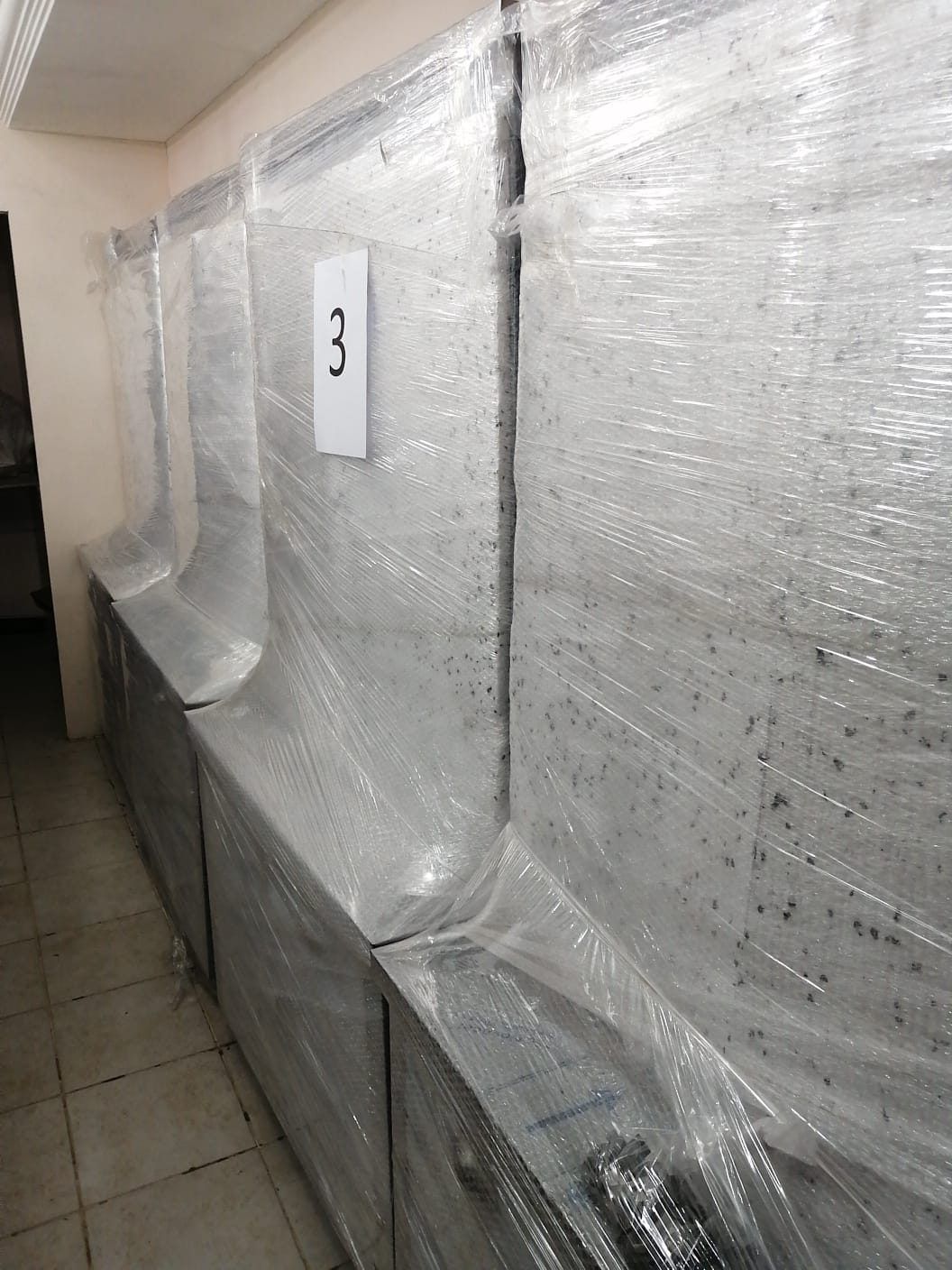 Packed: each unit wrapped, numbered and checked against the list.